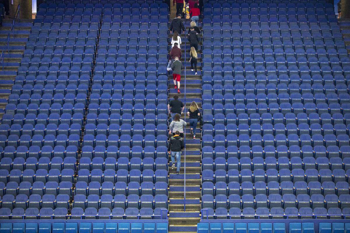 Fans left Rupp Arena after an indefinite suspension was announced for the boys’ and girls’ Sweet 16 state basketball tournaments.