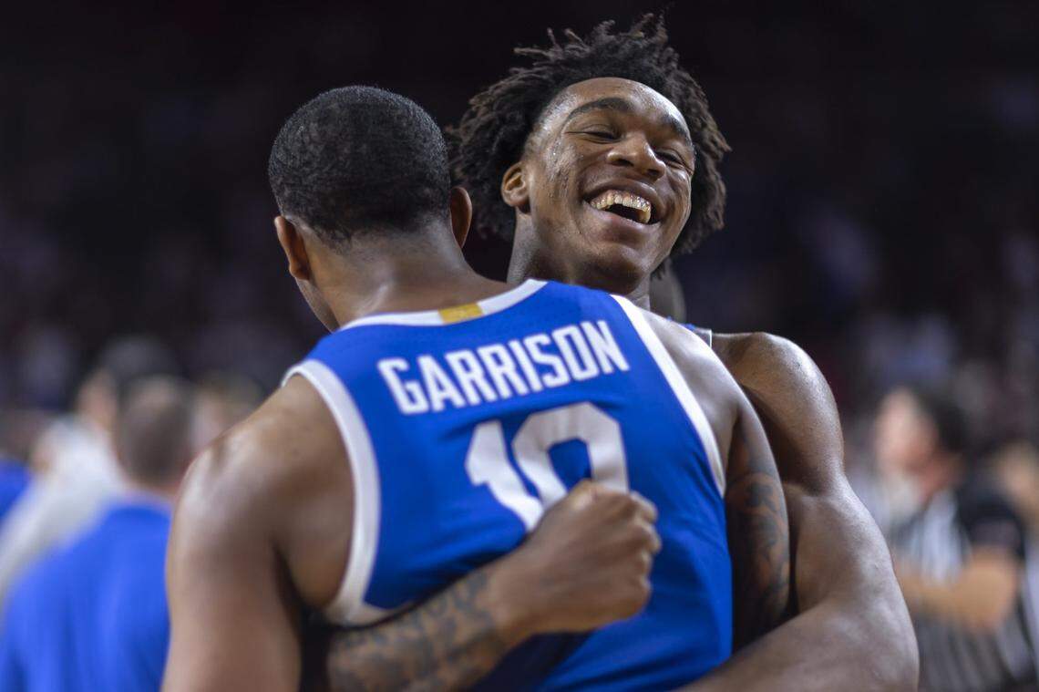 Kentucky center Amari Williams hugs forward Brandon Garrison after Kentucky’s win against Oklahoma on Feb. 26.