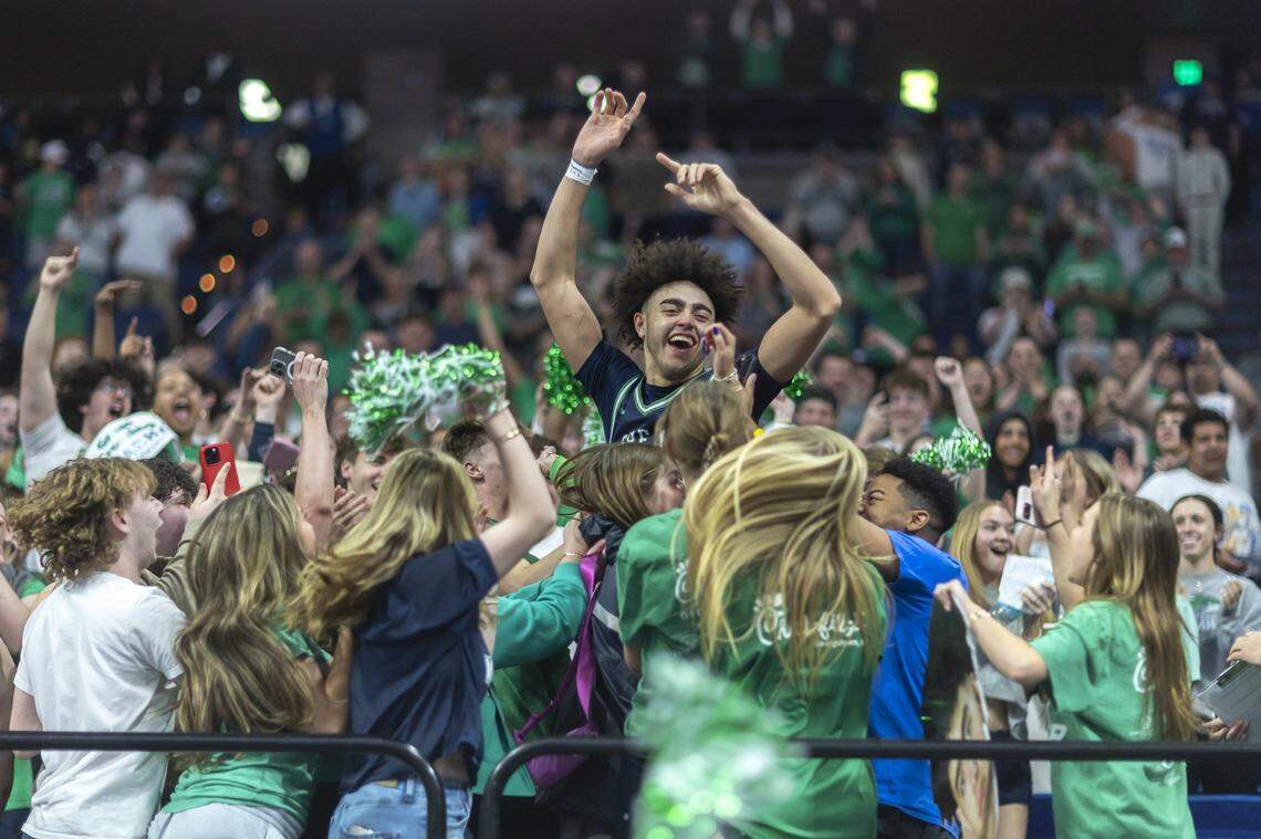 Kentucky freshman Malachi Moreno celebrates winning a state championship with the Great Crossing student section on March 29 at Rupp Arena.