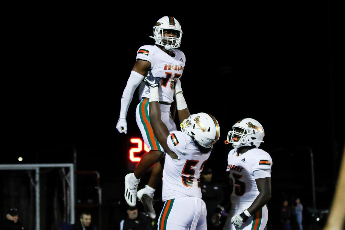 Ty Bryant (13) got a lift after scoring for Frederick Douglass on Friday night.
