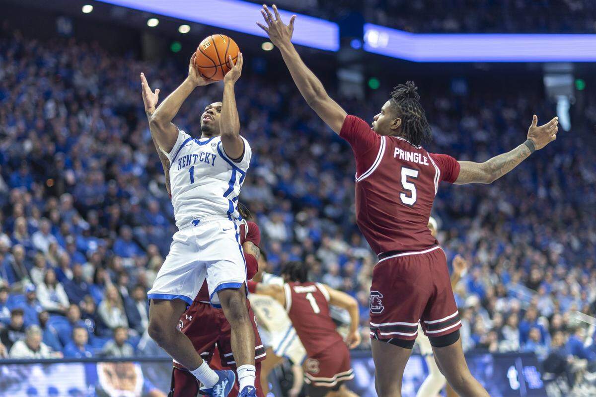 Kentucky guard Lamont Butler (1) looks to shoot the ball against South Carolina forward Nick Pringle (5) during Saturday’s game at Rupp Arena. Butler had missed UK’s last three games before Saturday’s contest.