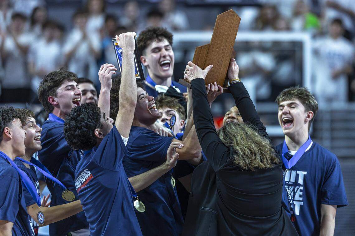 Great Crossing players cheer as they are given a trophy after beating Frederick Douglass during the Boys 11th Region Tournament championship game at Eastern Kentucky University's Baptist Health Arena in Richmond, Ky., on Monday, March 9, 2026.