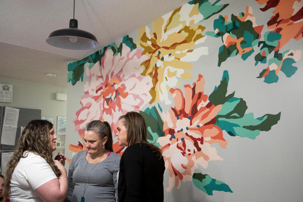 Megan Simpson talks with some her friends on the day of her graduation from the Women’s Addiction Recovery program at the Freedom House outside Manchester, Ky., Thursday, April 15, 2021.