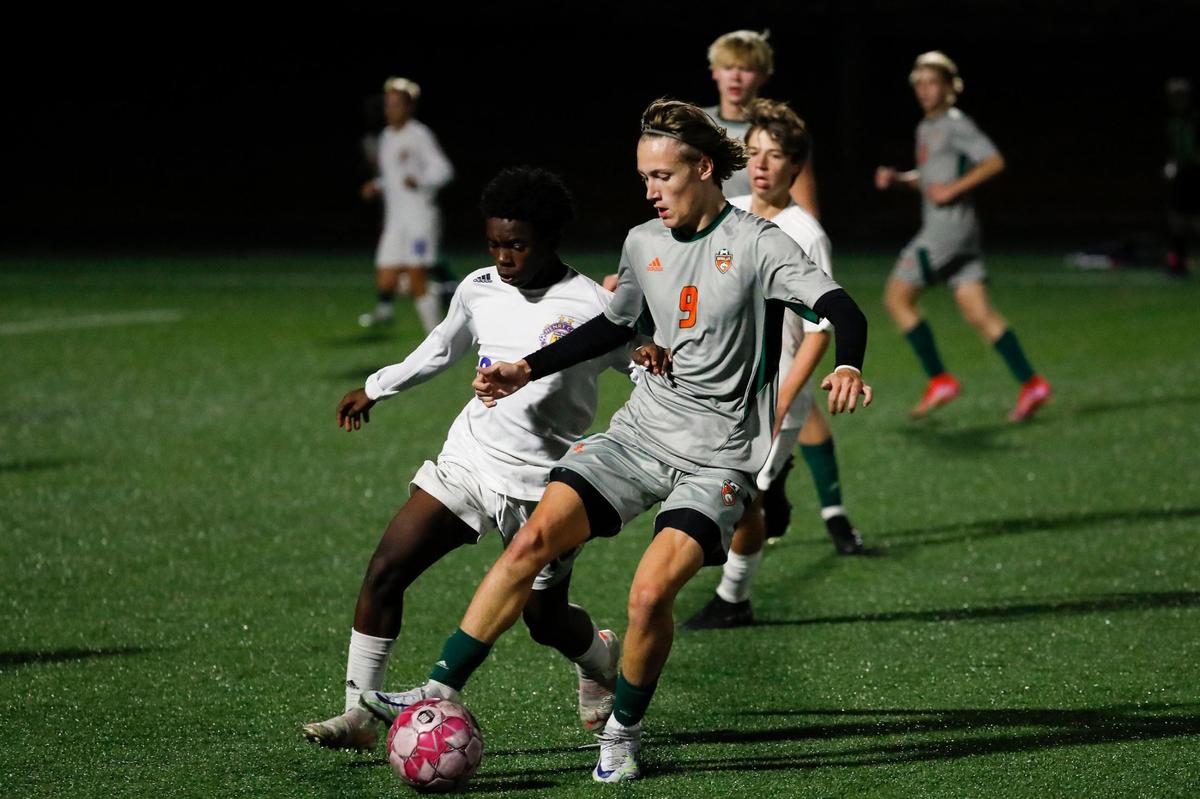 Frederick Douglass’ Josh Carr (9) dribbles the ball against Henry Clay during the 42nd District semifinals on Oct. 4.