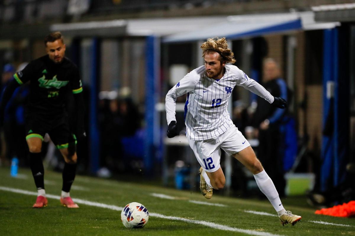 Kentucky midfielder Clay Holstad (12) tries to keep the ball in-bounds against South Florida during the first round game of the 2022 NCAA Men’s Soccer Tournament at the Wendell & Vickie Bell Soccer Complex in Lexington, Sunday.