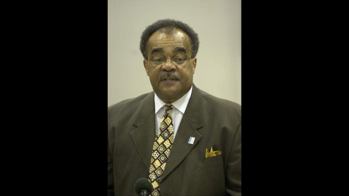 Rev. Bob Brown speaks as Fayette County leaders gather at Booker T. Washington Elementary School to announce the formation of a blue ribbon panel charged with finding ways to close the achievement gap in Lexington, Ky., on 3/28/02.
