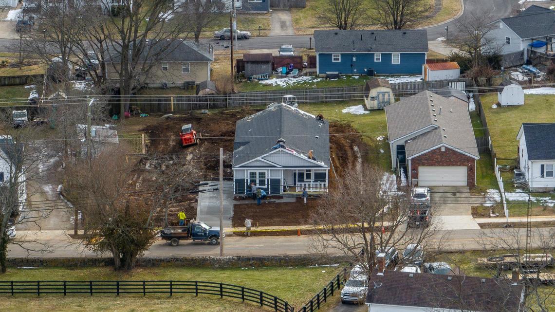 Workers install a manufactured home at 274 High Street in Versailles, Ky., Thursday, Jan. 30, 2025. The city of Versailles has a pilot project to install attractive manufactured homes into a residential neighborhood just outside downtown.