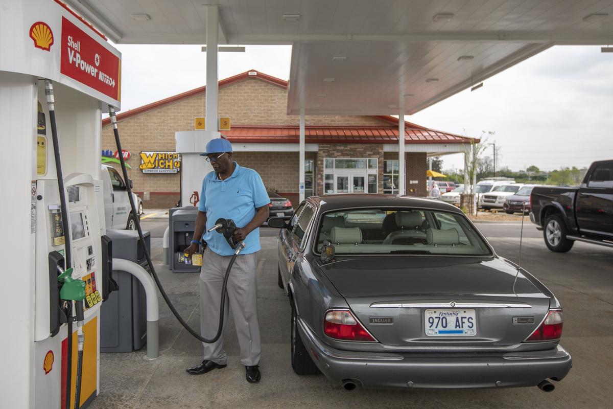 James Perkins, of Lexington, gets fuel for his vehicle at the gas pumps at the new Crossroads IGA on Leestown Road on Wednesday, April 24, 2019.