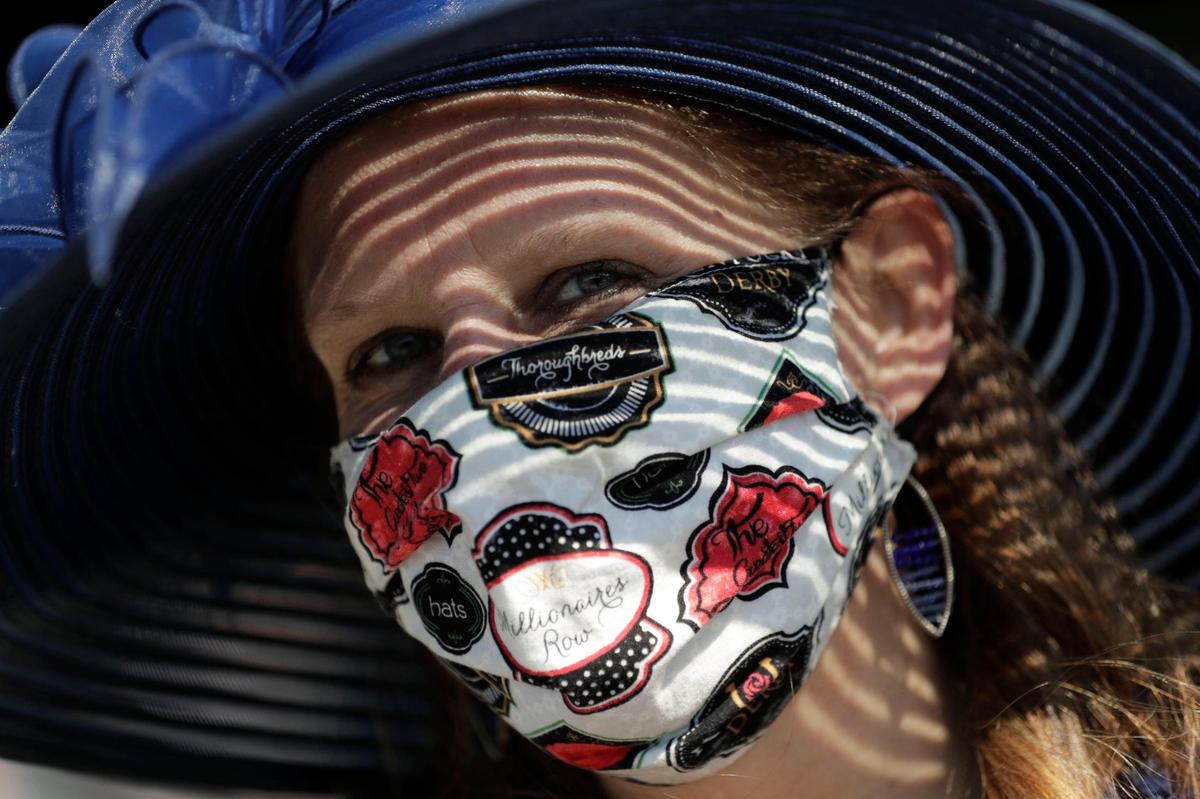 Pam Walton made her Derby-themed mask herself to wear to the Kentucky Derby at Churchill Downs in Louisville, Ky., Saturday, May 1, 2021.