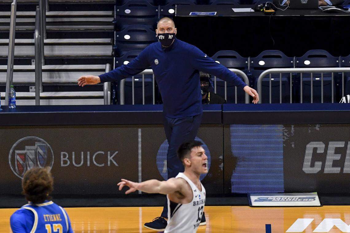 Mar 20, 2021; Indianapolis, IN, USA; Brigham Young Cougars head coach Mark Pope yells to his team during the game against the UCLA Bruins during the first round of the 2021 NCAA Tournament at Hinkle Fieldhouse.  Mandatory Credit: Patrick Gorski-USA TODAY Sports