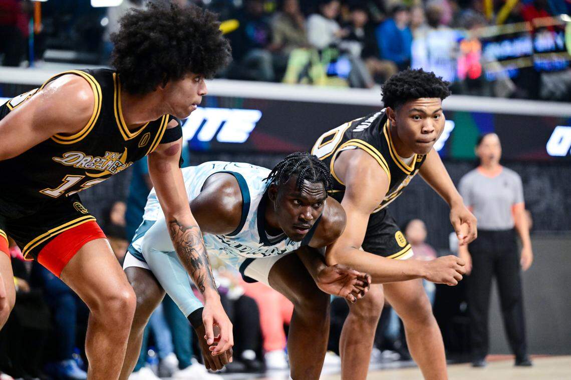 Somto Cyril of the Cold Hearts (center) boxes out Izan Almansa and Jaylen Martin of the YNG Dreamerz during an Overtime Elite league game on Friday, February 3, 2023 at OTE Arena in Atlanta, Georgia.
