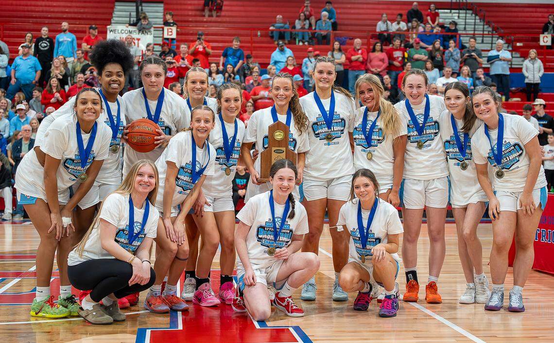 West Jessamine’s girls basketball team posed with their 12th Region Tournament championship trophy and medals after defeating Southwestern 48-39 in the girls 12th Region Tournament championship game at Lincoln County High School in Stanford on Saturday.