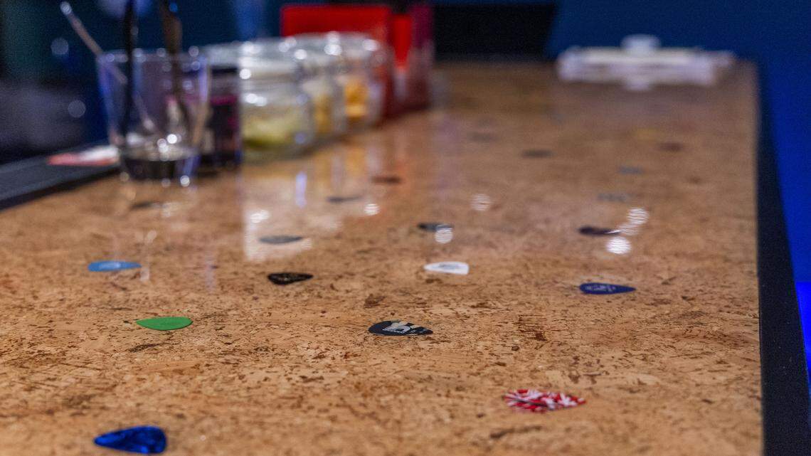 The new bar at the newly renovated and rebranded The Cork has guitar pics built in it. 