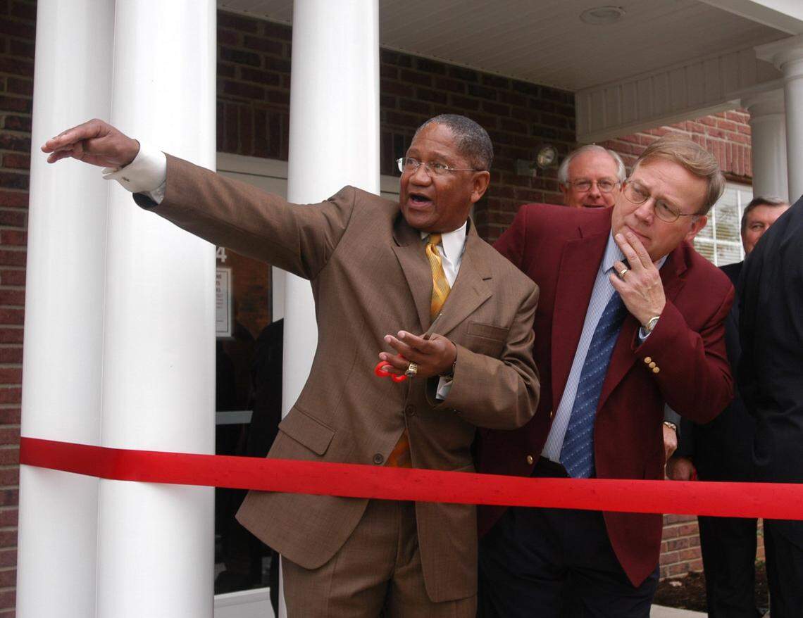 P.G. Peeples, CEO of Lexington’s Urban League, left, pointed toward other  property recently acquired, at right is Ben Cook, field office director, HUD,  at the dedication of a $3 Million, 24 unit senior citizens apartment complex  on Elm Tree Lane, Lexington, KY, Tuesday, October 28, 2003.