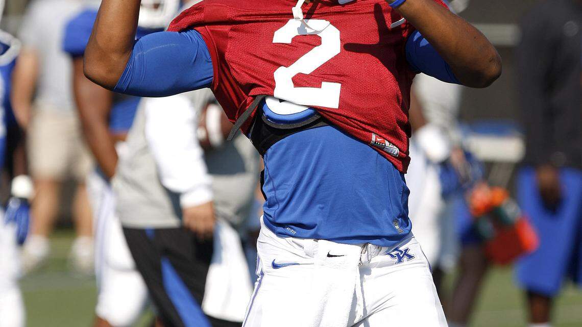 UK quarterback Jalen Whitlow throws during practice on the Tim Couch practice field in Lexington, Ky., Saturday, August 24, 2013. Photo by Matt Goins