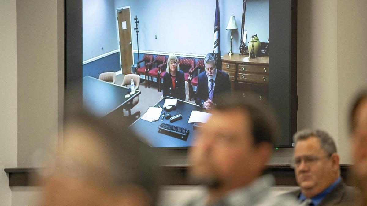Kentucky Juvenile Justice Commissioner Vicki Reed, on screen, left, and Justice Secretary Kerry Harvey appear remotely during a hearing by the state legislature’s Interim Joint Committee on Judiciary at the Kentucky state Capitol Annex in Frankfort, Ky., on Tuesday, Oct. 7, 2021. The committee was asking questions of Kentucky Juvenile Justice Commissioner Vicki Reed and Justice Secretary Kerry Harvey.