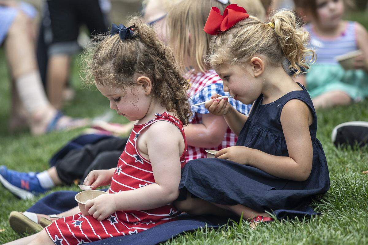 Emory McCauley, left, and Emerson Ganahl, both 2, eat pie and ice cream at the Great American Pie Contest and Ice Cream Social at Fifth Third Bank Pavilion in Lexington, Ky., Wednesday, July 3, 2019.