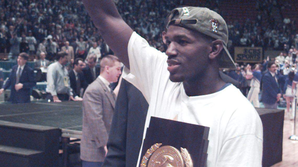 Tony Delk with the championship trophy. 1996 NCAA Basketball Tournament Championship game April 1, 1996 in East Rutherford, N.J. UK defeats Syracuse 76-67. Photo by Charles Bertram | Staff
