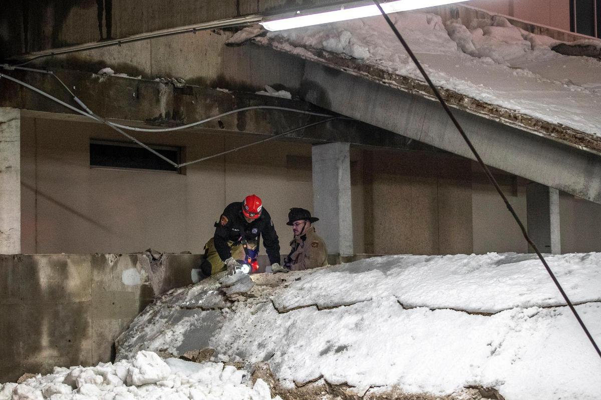 Members of the Lexington Fire Department respond to a parking garage that partially collapsed near South Mill and West High streets in Lexington, Ky., on Thursday, Feb. 18, 2021.