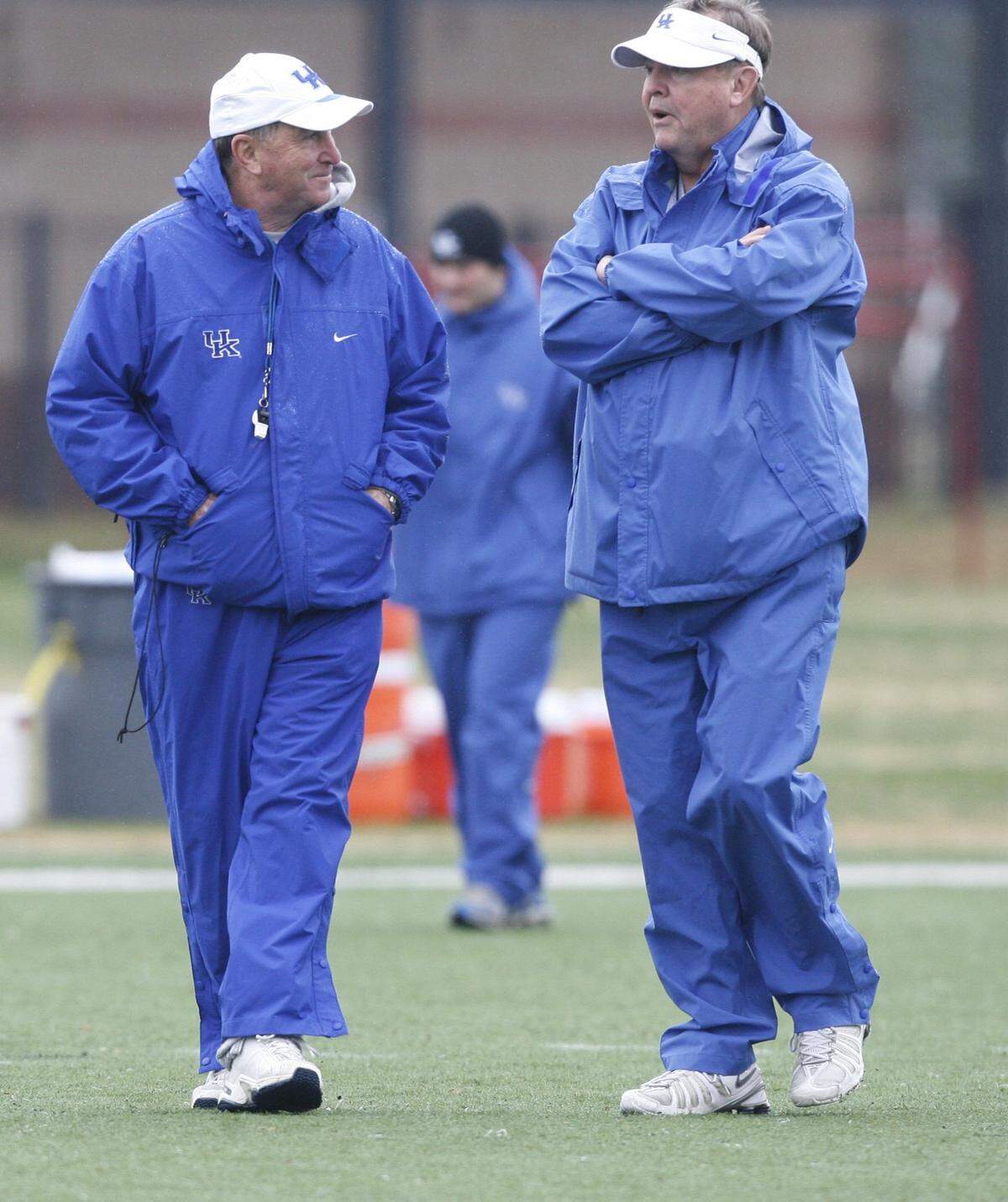Kentucky head coach Rich Brooks and assistant head coach Steve Ortmayer talked during practice for the Music City Bowl in Nashville in 2007.