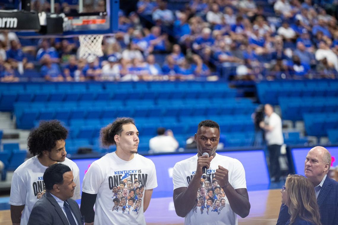 Jacob Toppin, left, Lance Ware, center, and Oscar Tshiebwe talk from the Rupp Arena court during the telethon for Eastern Kentucky flood victims Tuesday night.