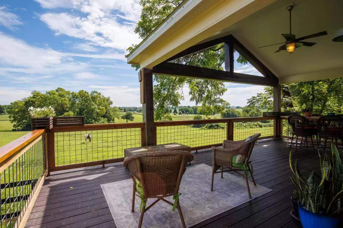 A view from the balcony at 4351 Betheld Road that overlook’s the property’s verdant horse pastures.