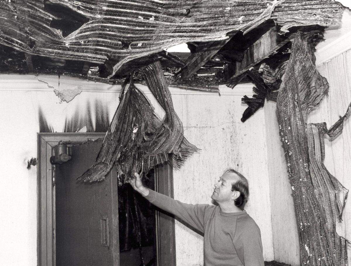 Fire damage at the Kentucky theatre in 1987. Fred Mills looks over the damage by smoke that was caused by the fire next door (a restaurant) to the Kentucky Theater. The ceiling was the Men s room. Photo by John C. Wyatt/Lexington Herald-Leader