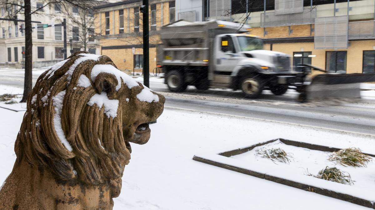 A snowplow moves down Main Street in downtown Lexington, Saturday, Jan. 24, 2026, as Winter Storm Fern started to bring heavy snowfall and sleet across Lexington and Central Kentucky.