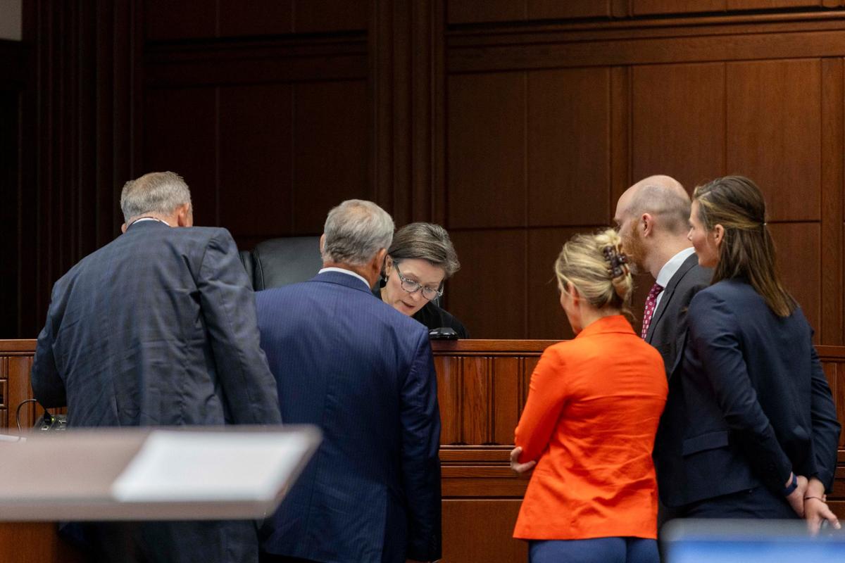 Defense attorneys and prosecutors stand before Fayette Circuit Judge Lucy VanMeter on Tuesday during the rape trial against John Tilley.