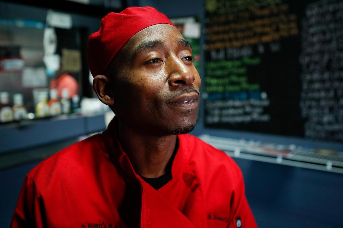 Robert Williams, of Lexington, Ky., executive chef at Mr. Krabs & Bean’s BBQ in the restaurant’s dining room in Lexington, Ky., Thursday, Nov. 19. 2020. Williams first started with a 18-foot smoker set up inside a small 15-foot by 15-foot tent in the parking lot of the Parkway Center strip mall on Eastland Parkway in the summer of 2018 before eventually moving to the current location on Georgetown Street.