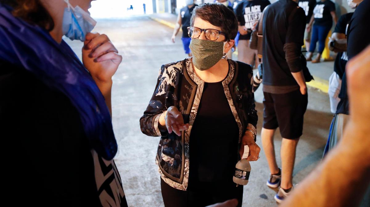 Lexington Mayor Linda Gorton speaks with University of Kentucky football players before a march supporting Black Lives Matter through downtown Lexington, Ky., Friday, June 5, 2020.