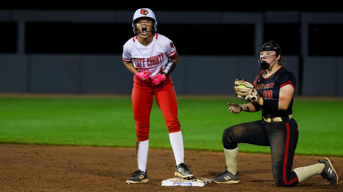 Scott County’s Makiah Jackson exults after the Cardinals scored a run during their 3-2 win over Bullitt East in the opening round of the Softball State Tournament in Lexington on Thursday night.