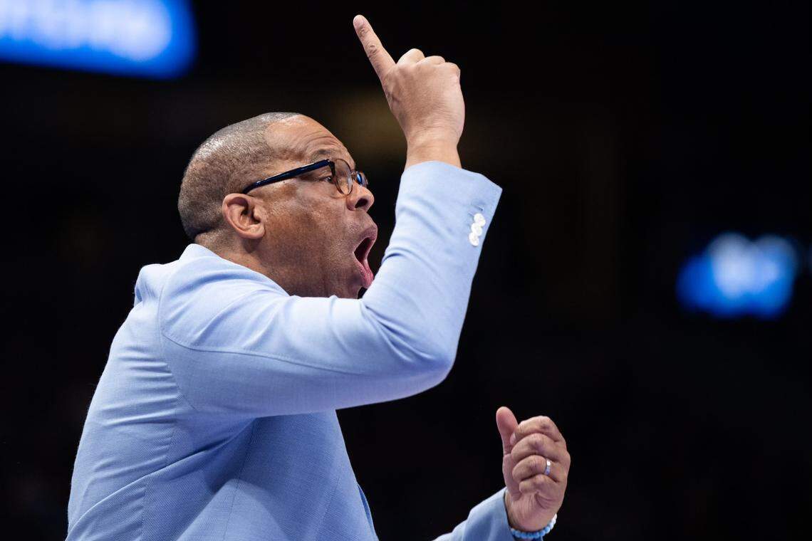 North Carolina head coach Hubert Davis shouts instructions to his players during the CBS Sports Classic against Kentucky.