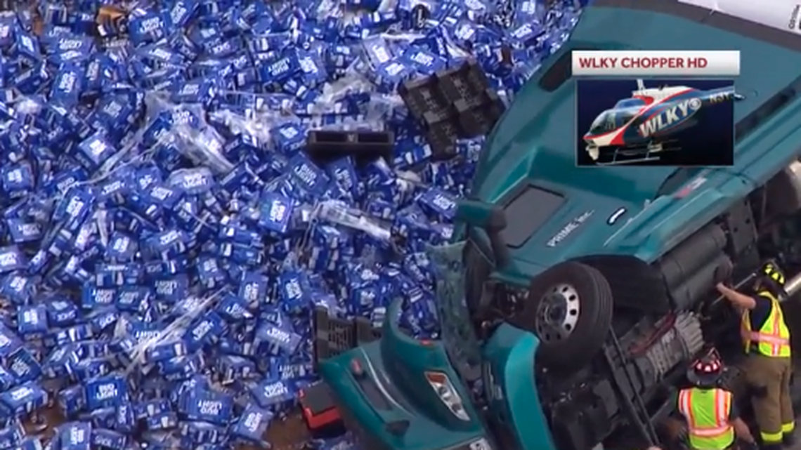 Thousands of cans of Bud Light spilled out of a semi truck that overturned in Louisville.