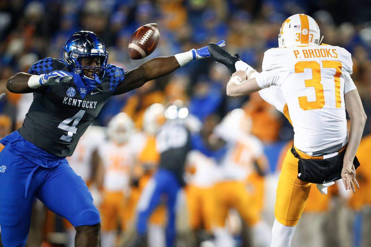 Kentucky’s Josh Paschal (4) blocked a punt by Tennessee’s Paxton Brooks. It set up a UK touchdown in the Wildcats’ 17-13 loss to UT last week.