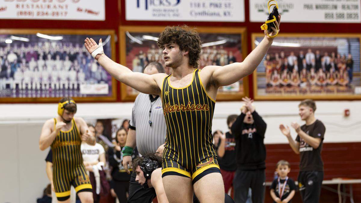Harrison County’s Daniel Switzer celebrated his pinfall win over Bryan Station’s Charles Farley for the 190 title at the KHSAA Boys/Co-ed Region 6 Wrestling Championships at Harrison County High School in Cynthiana on Saturday.