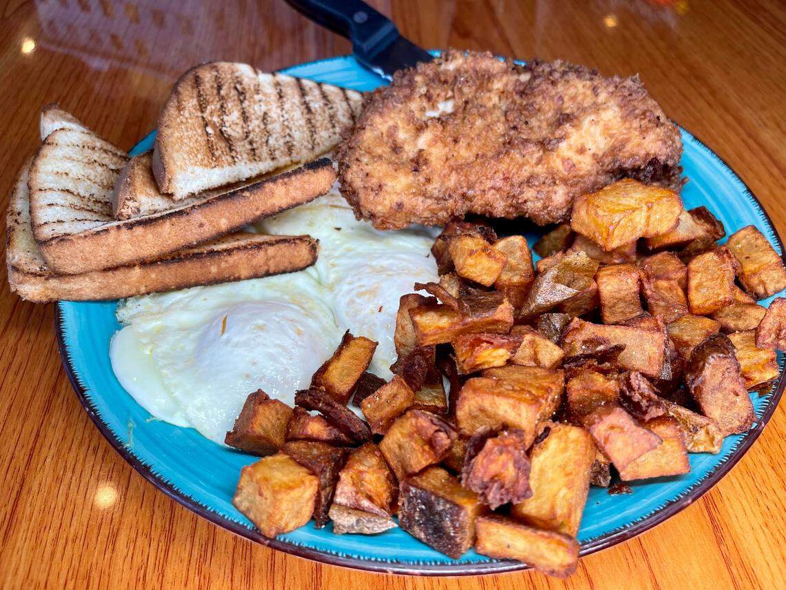 Ramsey’s Diner’s Chops & Eggs. Two fried pork chops, two eggs, breakfast potatoes, and toast.