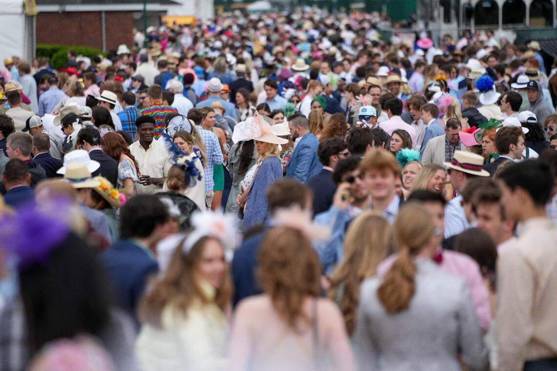 Spectators gather on the infield on the day of the 148th Kentucky Derby at Churchill Downs in Louisville, Ky., Saturday, May 6, 2022.