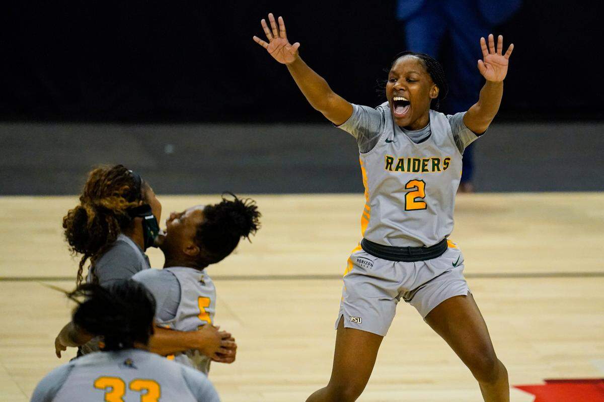 Former Frederick Douglass standout Destyne Jackson (2) celebrated after Wright State defeated IUPUI 53-41 in the Horizon League championship game.