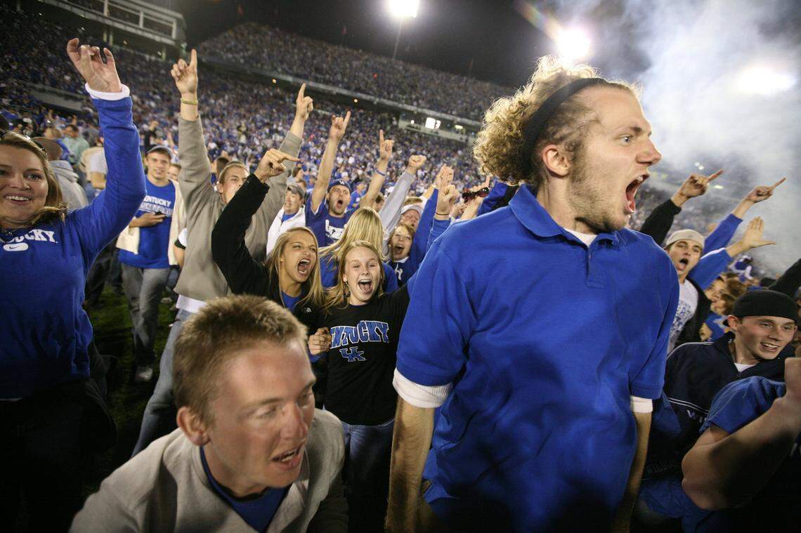 Kentucky fans stormed the field in jubilation after the Wildcats upset No. 1-ranked LSU 43-37 in three overtimes on Oct. 13, 2007, in Lexington. UK has not defeated a No. 1 team in eight attempts since then but will have another go at it Saturday night against Georgia in Athens.