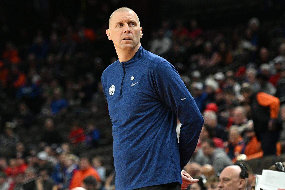 Mar 21, 2024; Omaha, NE, USA; Brigham Young Cougars head coach Mark Pope keeps an eye on the action in the first half Duquesne Dukes during the first round of the NCAA Tournament at CHI Health Center Omaha. Mandatory Credit: Steven Branscombe-USA TODAY Sports