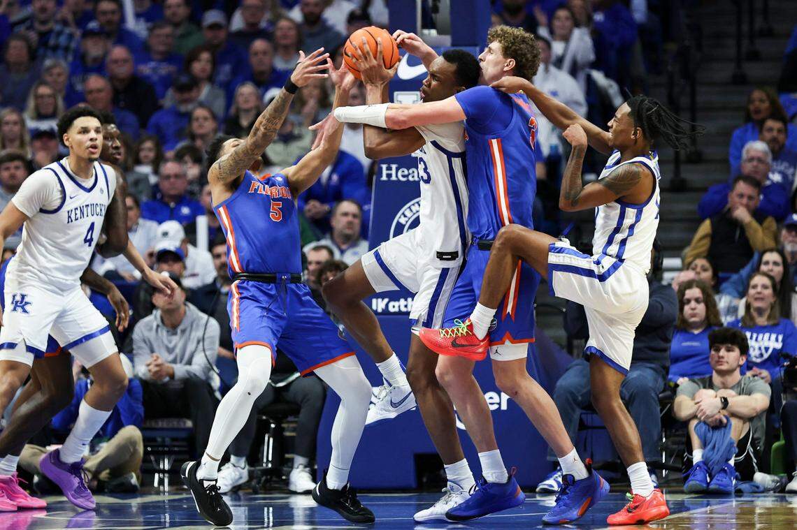 Kentucky forward Ugonna Onyenso, center, grabs one of his 16 rebounds against Florida during Wednesday’s game at Rupp Arena.