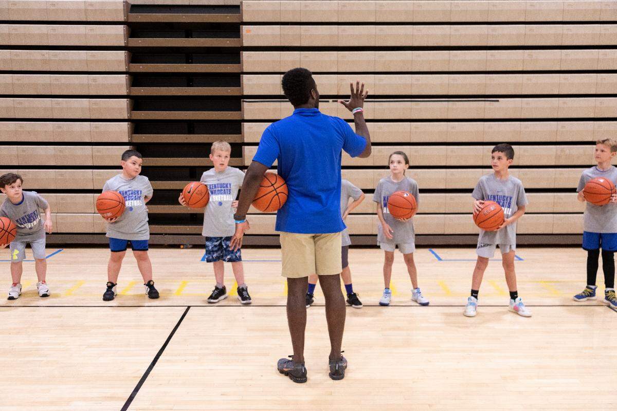 Ceasar Adim gave instructions to participants in a University of Kentucky youth basketball camp at Ryle High School this month. Adim, who is working with UK’s staff as part of the McLendon Minority Leadership Initiative, aspires to become a coach.