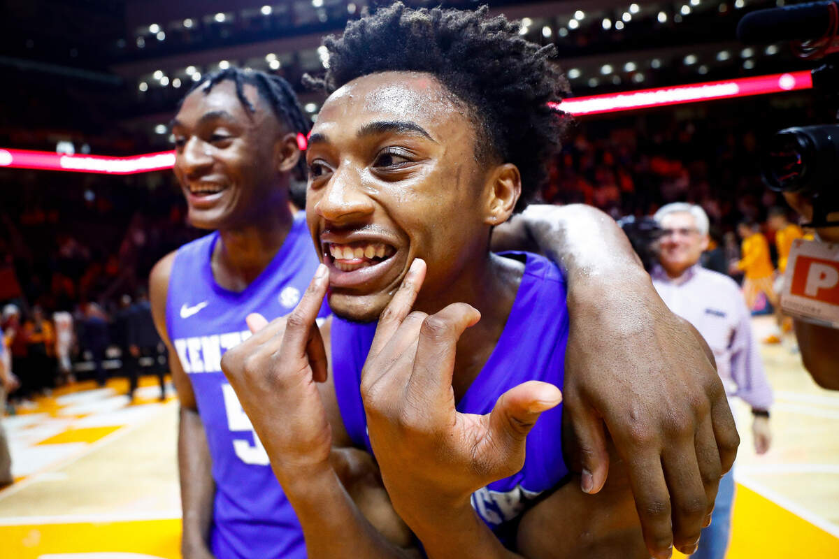 Kentucky Wildcats guard Immanuel Quickley, left, and guard Ashton Hagans celebrate after their game against the Tennessee Volunteers at Thompson-Boling Arena in Knoxville, Tenn., Saturday, Feb. 8, 2020. Kentucky beat Tennessee 77-64.