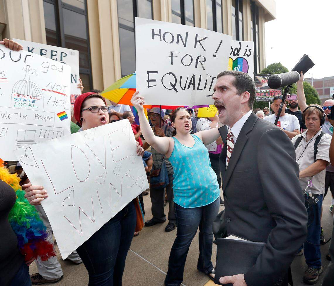Street preacher Jeffrey Shook, with Unity Baptist Church in Hickory, N.C., preaches to Kim Davis protestors in front of the Carl D. Perkins Federal Building in Ashland, Ky., on Thursday, Sept. 3, 2015. Davis was found guilty by U.S. District Judge David Bunning of contempt of court for refusing to issue marriage licenses in Rowan County, Ky. (Charles Bertram/Lexington Herald-Leader/TNS)