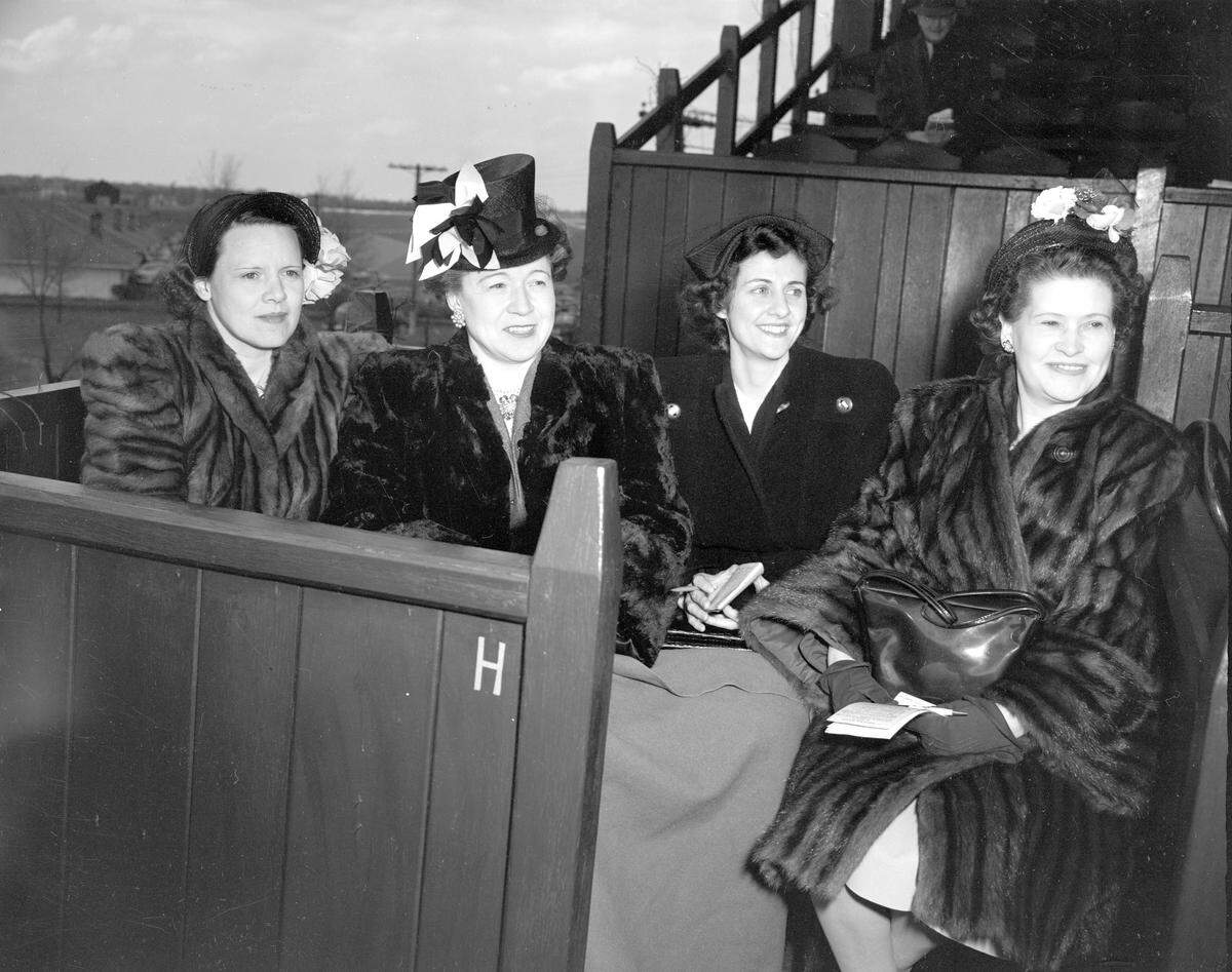 Mrs. Frank Atkins, Mrs. P.J. Sawyer, Mrs. Lewis Bush and Mrs. L.Q. Bickett were guests in Mr. and Mrs. Barckley Storey's box at during the 1947 Keeneland Spring Meet. The photo was published in the April 21, 1947, Lexington Leader, alongside other social news items. The 1947 spring meet lasted 11 days.