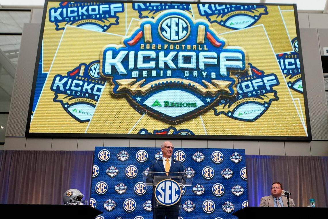 Southeastern Conference commissioner Greg Sankey speaks during SEC Media Days, Monday, July 18, 2022, in Atlanta. Person at right is unidentified. (AP Photo/John Bazemore)