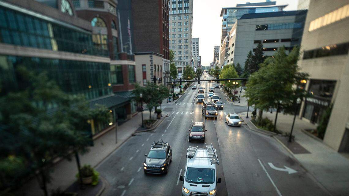 Vehicles drive along West Main Street in downtown Lexington, Ky.