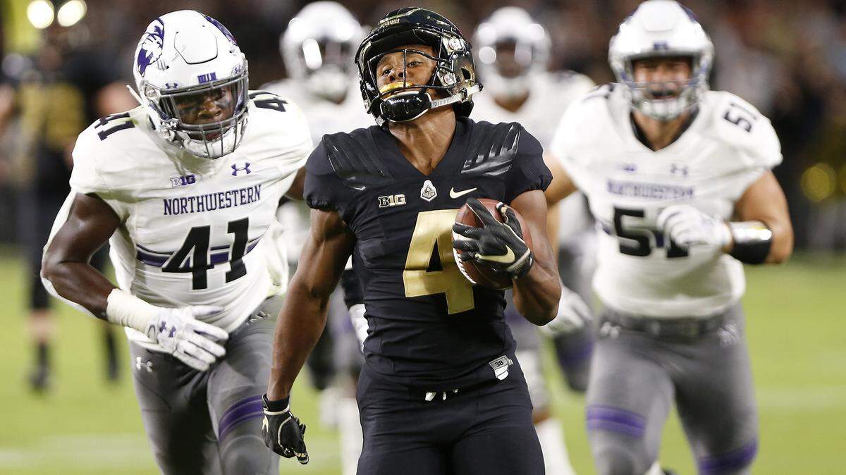 Purdue’s Rondale Moore runs for a long touchdown against Northwestern near the end of the first quarter of an NCAA college football game Thursday, Aug. 30, 2018, in West Lafayette, Ind.