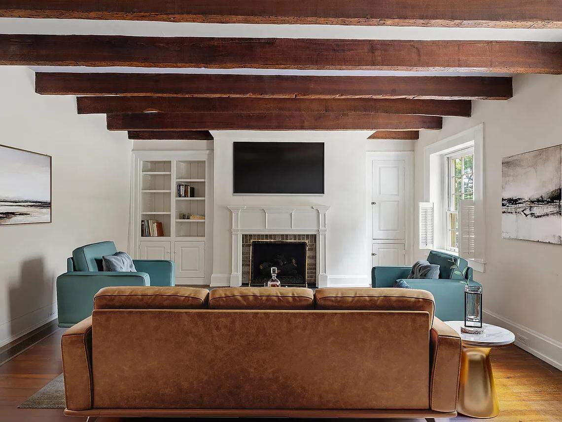 A view of the den in 220 Market Street, known as the Peter Paul House. Exposed wooden beams line the ceiling, making for a striking image.